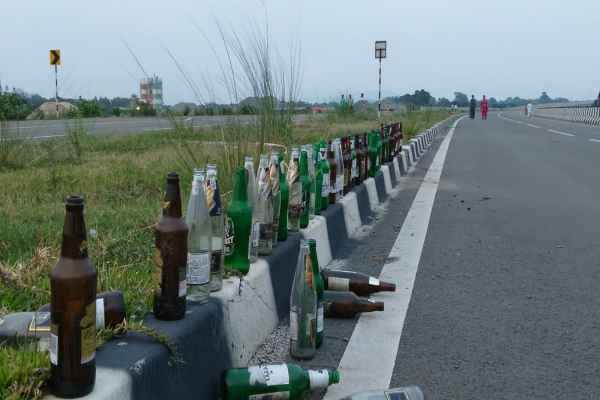 Saraikela: Pile of beer bottles on Chandil NH-32 bypass; roadside turns into a haunt for drinkers.
