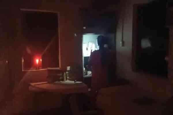 The delivery was taking place by candlelight.