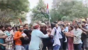 During the protest, students surrounded and beat up a police officer; other students rescued him
