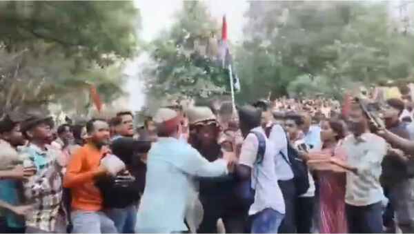 During the protest, students surrounded and beat up a police officer; other students rescued him